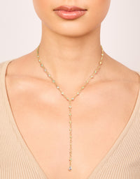 Crafted from gold plated materials, this cubic zirconia blue circle detail Y-necklace in dainty design on neck view - link has visual effect only