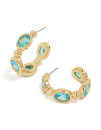 Elevate your style with gold plated cubic zirconia blue oval hoop earrings in aqua front view - link has visual effect only