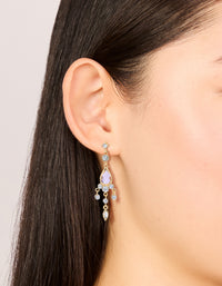 Showcasing gold plated pink cubic zirconia drop detail earrings featuring charm on ear view - link has visual effect only
