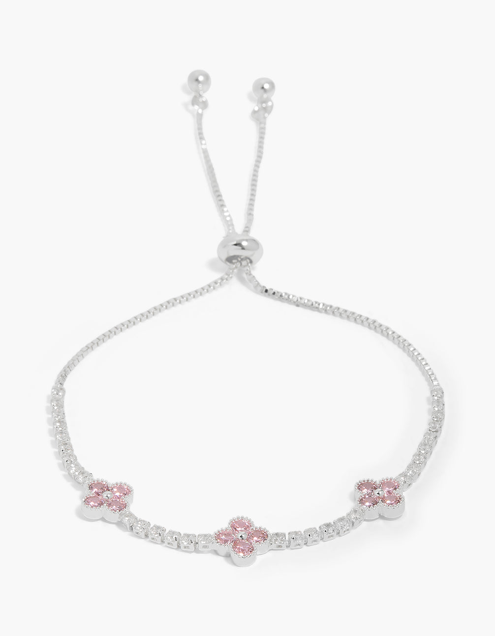 Showcasing a silver plated cubic zirconia flowers station toggle bracelet in light pink front view