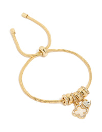 Showcasing a gold plated cubic zirconia flower and heart toggle bracelet with charm details front view - link has visual effect only