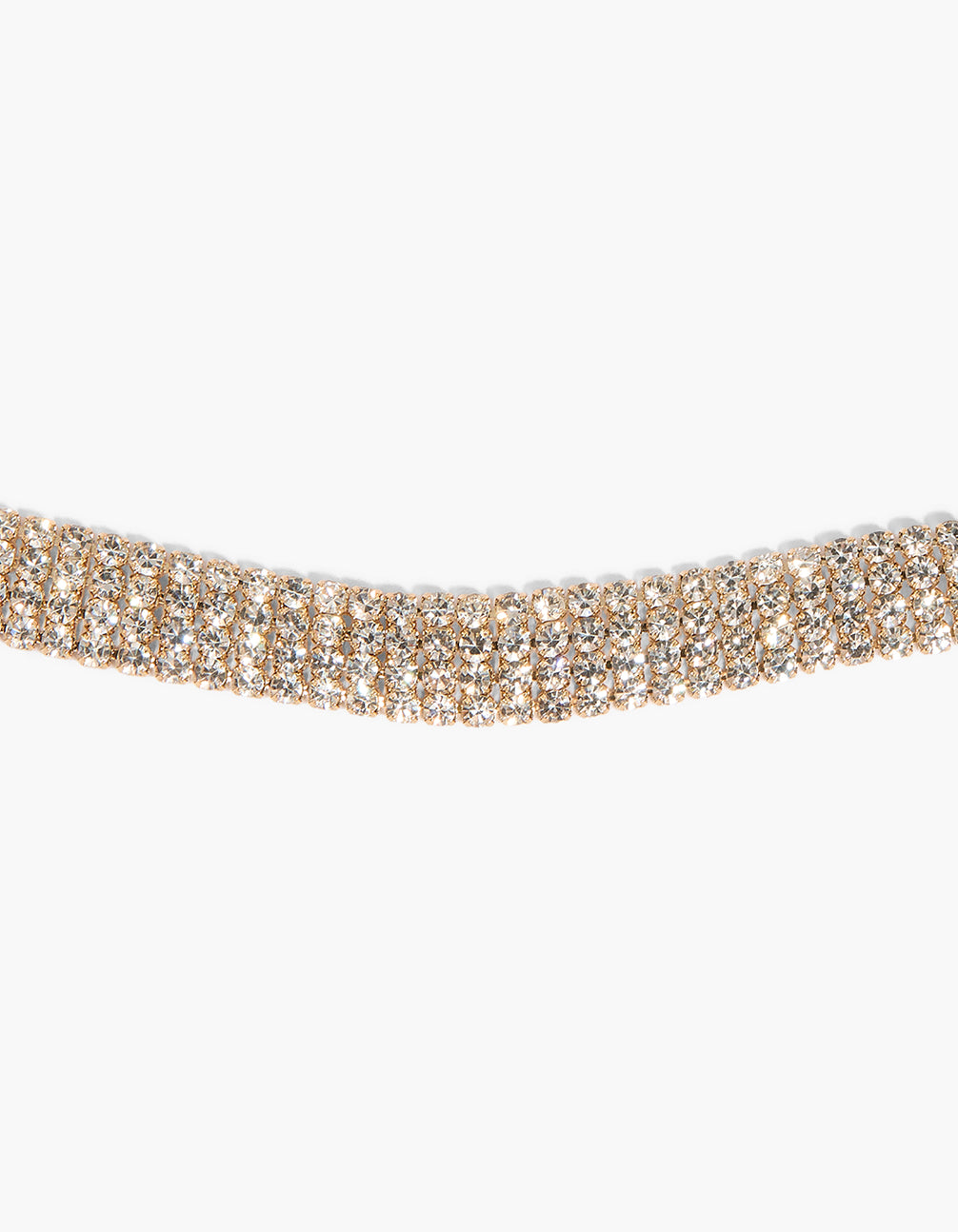 Crafted from glittering diamante materials, this gold tassel necklace features a braided chain design close up view